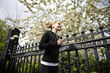 A mid adult woman jogging, wearing headphones
