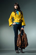 Studio fashion picture from a young model with bag Studio fashion picture from a young model with bag