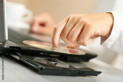 Photo: Woman hand with CD Woman hand with CD