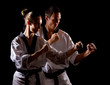 Foto: People in kimono make martial arts exercise People in kimono make martial arts exercise
