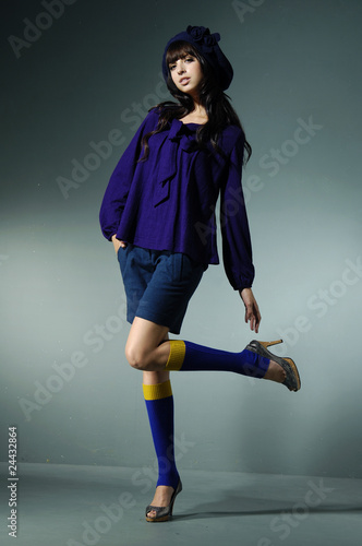 Photo: model in autumn clothes posing over white model in autumn clothes posing over white