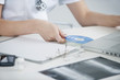 female doctor inserting cd into a laptop