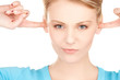woman with fingers in ears