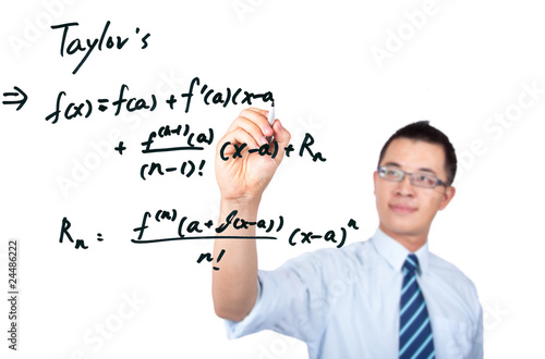 Photo: young teacher drawing a Mathematical formula young teacher drawing a Mathematical formula
