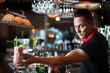 Photo: Young bartender with cocktail Young bartender with cocktail
