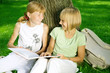 Two School Girls Reading the Book outdoor