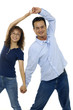 young couple holding hands over white
