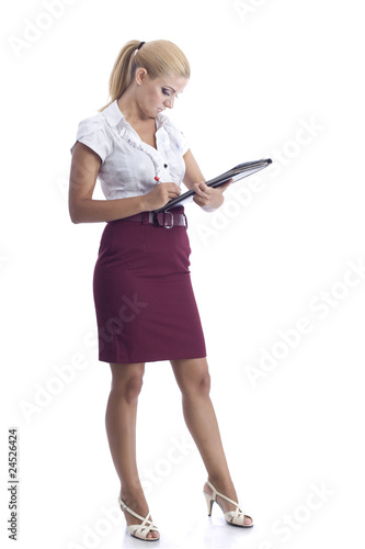 young beautiful woman signing a document