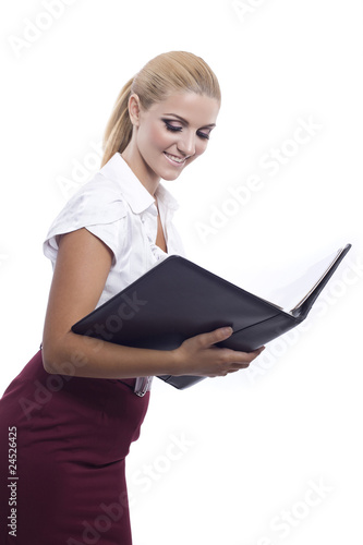 young beautiful woman signing a document
