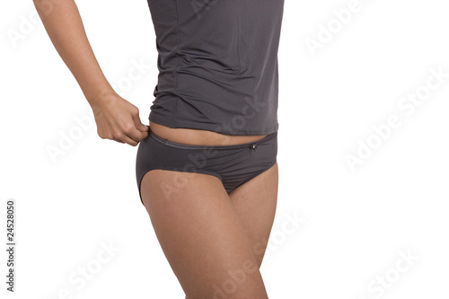 Photo: Sexy young woman in gray panties and t-shirt Sexy young woman in gray panties and t-shirt