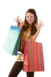Beautiful shopping girl with bags indicating OK sign