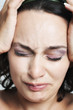 Photo: closeup of young woman suffering from pain closeup of young woman suffering from pain