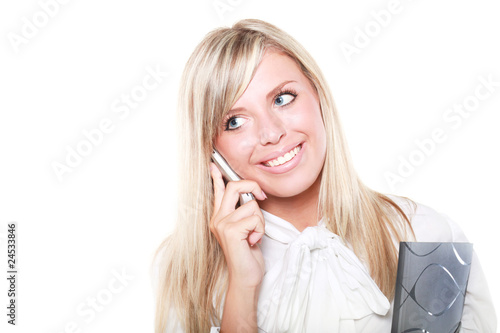Photo: Young beautiful happy blond buisinesswoman with mobile phone Young beautiful happy blond buisinesswoman with mobile phone