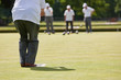 Game of Lawn Bowls - Player about to Bowl