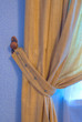 brown curtain in the wings with a blue wall