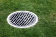 Drain Manhole surrounded by grass Drain Manhole surrounded by grass