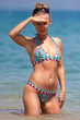 Young woman standing in water