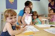 Preschool girl writes
