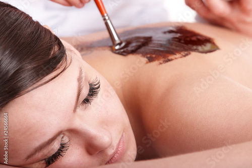 Photo: Girl having chocolate body mask . Girl having chocolate body mask .