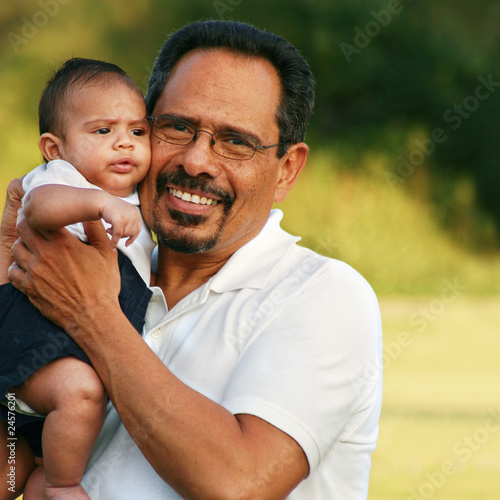 Photo: Granfather bonding with baby grandson in the park Granfather bonding with baby grandson in the park