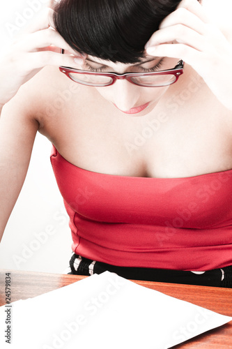 Photo: Women with headache tries to focus Women with headache tries to focus