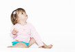 The little girl on a light background