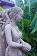 Thai ancient woman in the flower garden Thai ancient woman in the flower garden