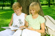 Two School Girls Reading the Book outdoor