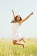 Jumping girl  at cereals field