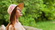 Young beautiful girl with hat posing outdoor