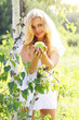 Beautiful girl holding green apple