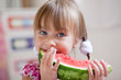 Funny child eating watermelon