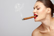 Woman smoking cigar.