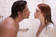 naked Man and woman in love are kissing in shower