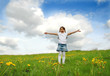 Little girl playing on meadow