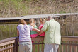Family Looking at the Water on the Dock Family Looking at the Water on the Dock