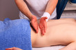 Young man gets back massage Young man gets back massage