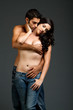 Sexy young multiracial couple with blue jeans