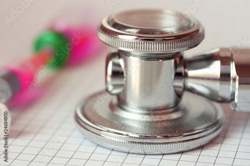 Photo: Close up stethoscope and syringe Close up stethoscope and syringe