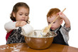 Kids measuring and mixing in kitchen Kids measuring and mixing in kitchen