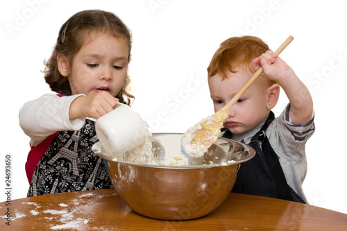 Photo: Kids measuring and mixing in kitchen Kids measuring and mixing in kitchen