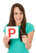 Foto: Teenager holding P plate and car key Teenager holding P plate and car key