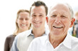 Foto: Old man smiling with his son and daughter in background Old man smiling with his son and daughter in background