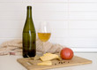 Still-life with cheese and tomato, white wine