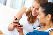 Cute young girls checking out their new mobile