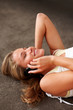 Happy teenage girl lying on floor and talking on mobile