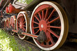 big red rusty wheels of old steam engine