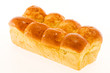 Photo: Brioche au beurre sur fond blanc Brioche au beurre sur fond blanc