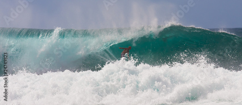 Photo: Fearless Surfer Riding a Huge Wave Fearless Surfer Riding a Huge Wave