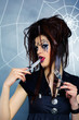 spider girl licking knife